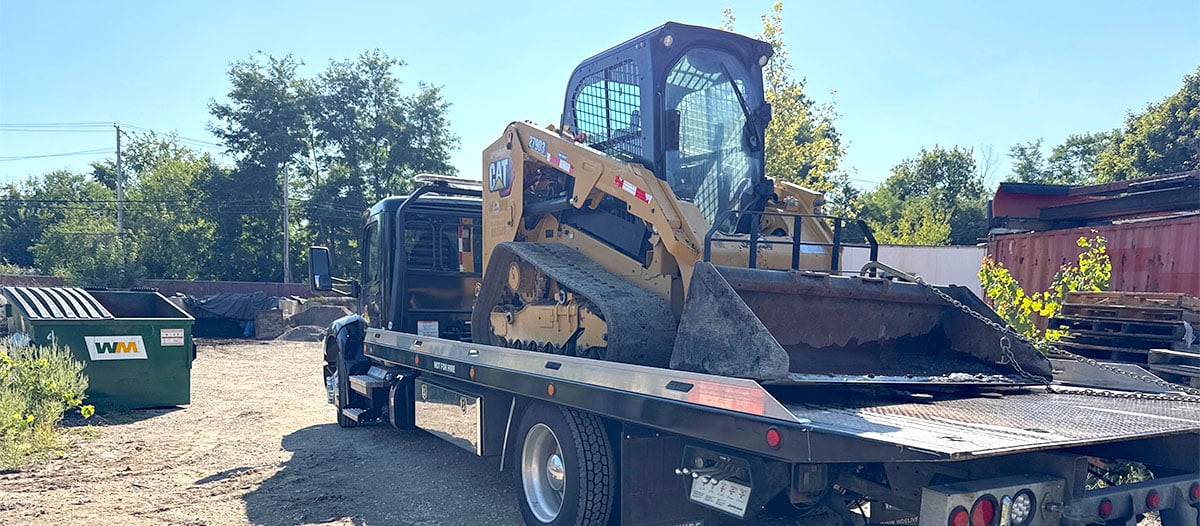 Track Loader on a trailer